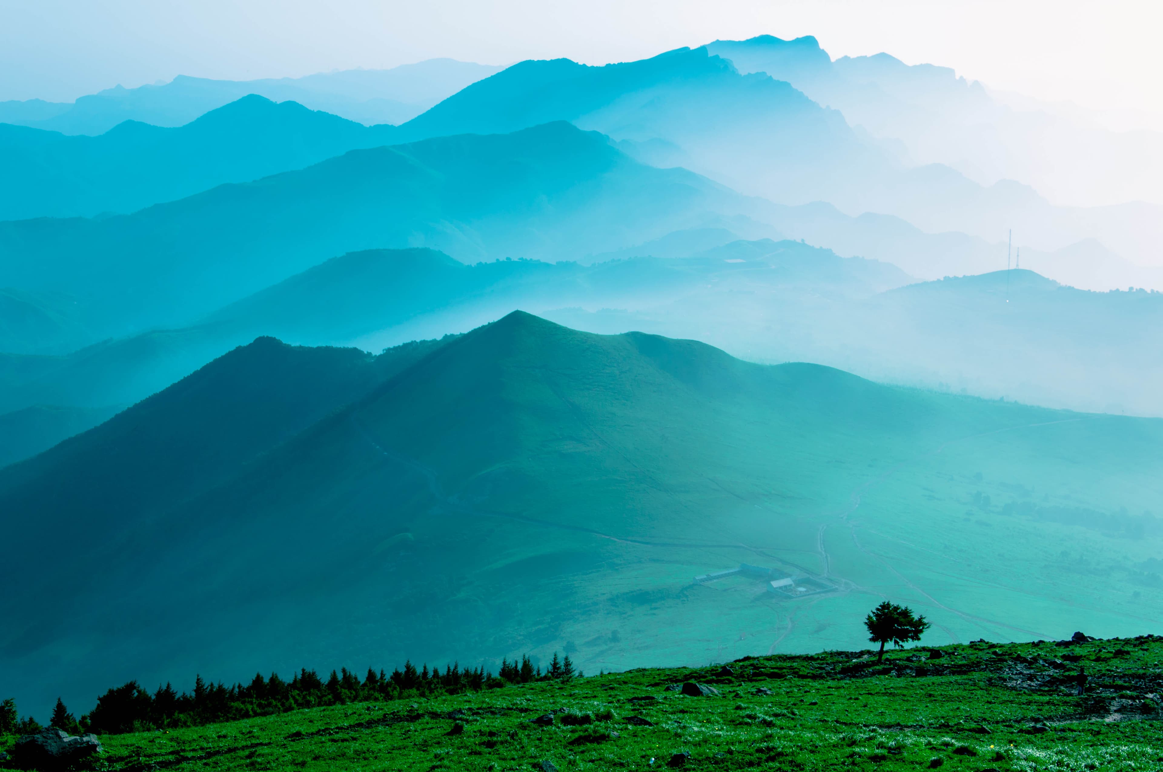 Layered misty blue mountains at dawn